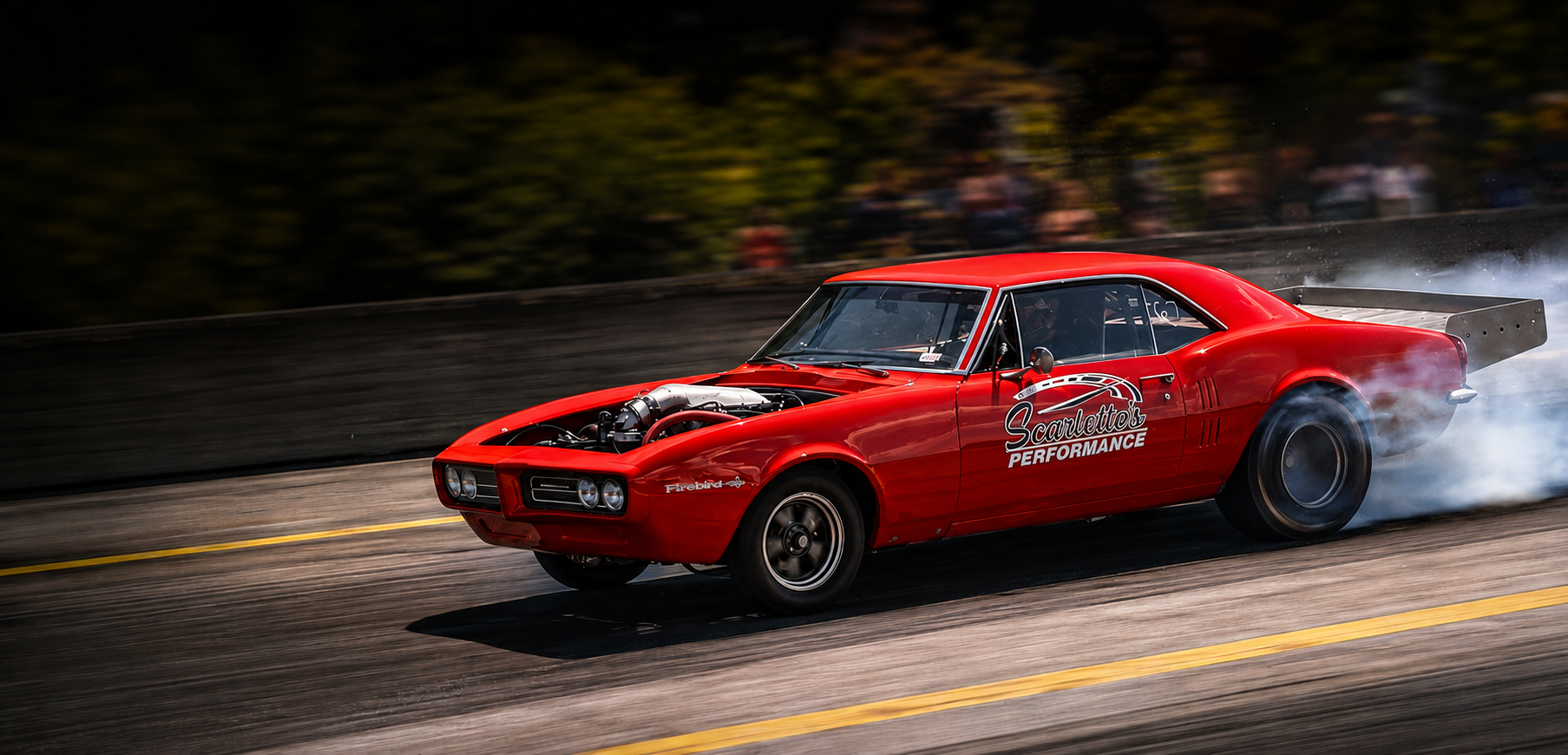Scarlette's Performance red Firebird launching down the track